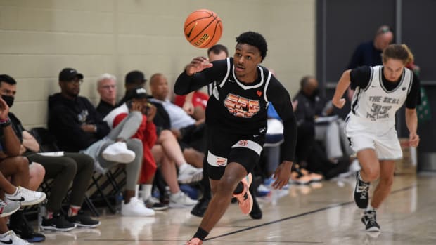 Bronny James dribbles the ball.